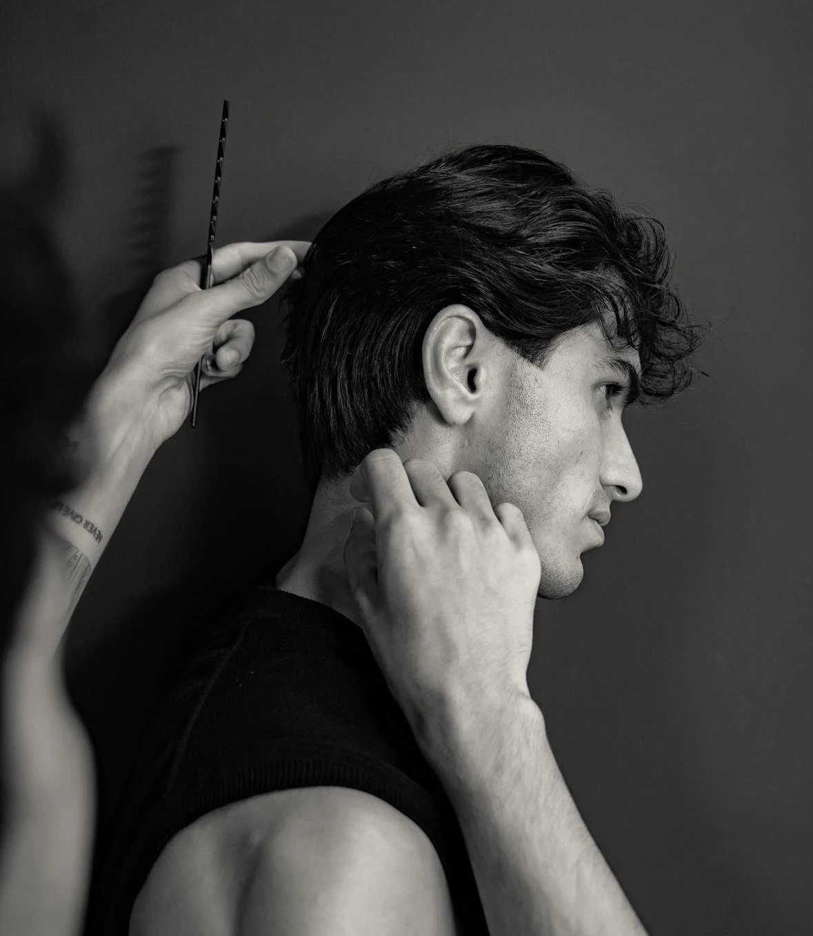 Private hairstylist perfecting a client's cut at home in Dubai